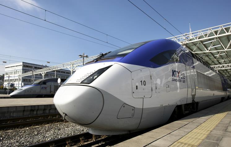 A Korea Train Express (KTX) II high-speed train pulls out of the Seoul Station in Seoul, South Korea, on Wednesday, Nov. 3, 2010. South Korea will begin full-fledged bullet train operations between Seoul and Busan. Photographer: SeongJoon Cho/Bloomberg via Getty Images