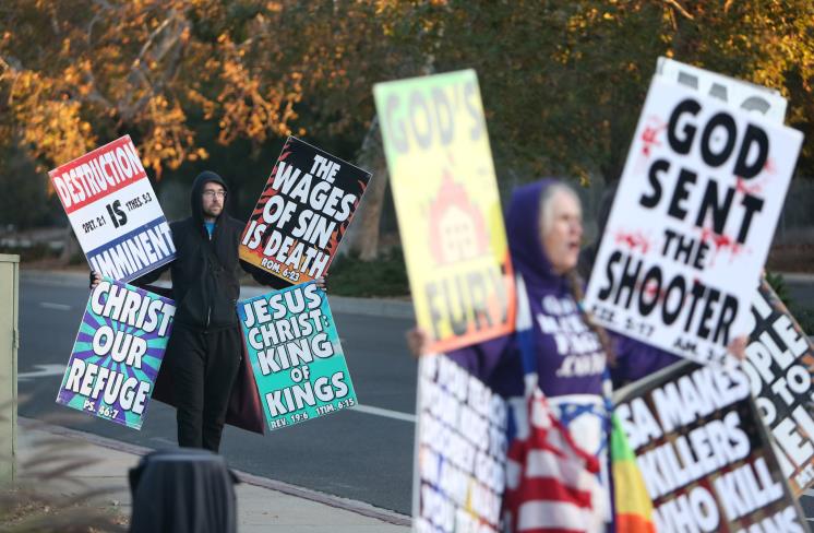 CLAREMONT, CA - NOVEMBER 12: Matt Holroyd, left, and Shirley Phelps-Roper, both members of Westboro Baptist Church, stand outside Claremont High School picketing and preaching the gospel in Claremont on Monday, November 12, 2018. Several Westboro Baptist Church members were in Claremont early Monday morning to protest ″perverted″ Pomona College over a planned class on homosexuality. (Photo by Stan Lim/Digital First Media/The Press-Enterprise via Getty Images)