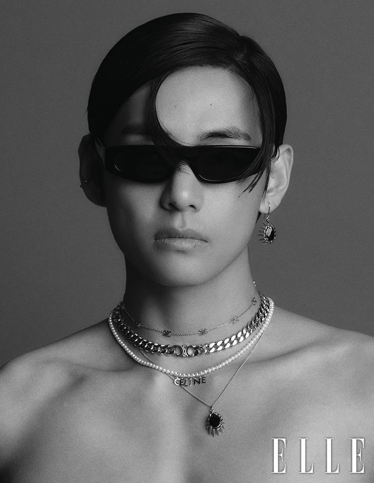 Sci-Fi Sunglasses with Black Strass Drop Earrings, Logo Choker with Bold Chain Necklace, Pearl Necklace with Logo Charm, and Black Strass Pendant Necklace are all from Celine Homme.