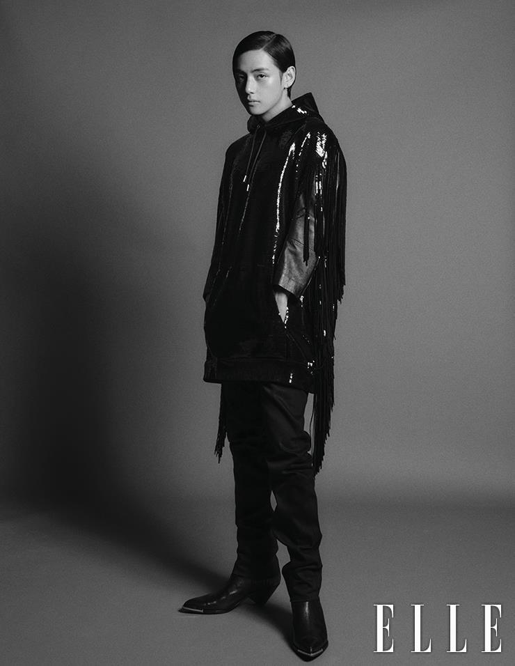 Spangled Hooded Knit Top with Fringes layered with a Leather Jacket, Black Denim Pants, Chelsea Boots with Metal Details are all from Celine Homme.